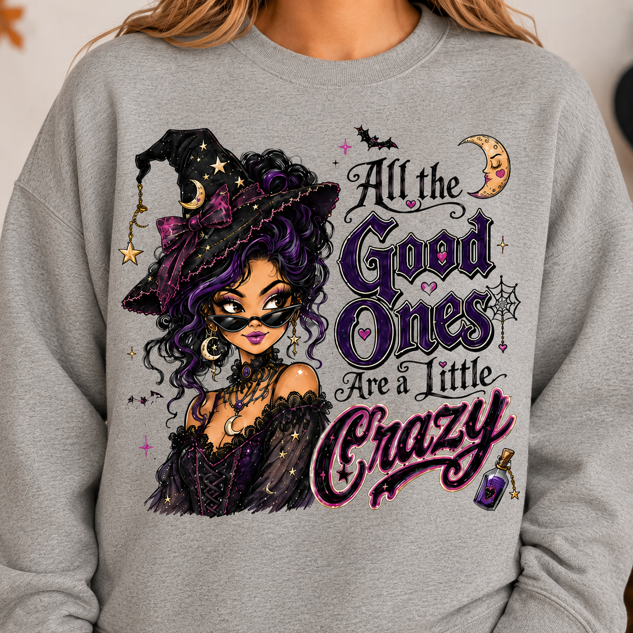 Cement Halloween witch sweatshirt with “All the Good Ones Are a Little Crazy” graphic in purple, pink and black.