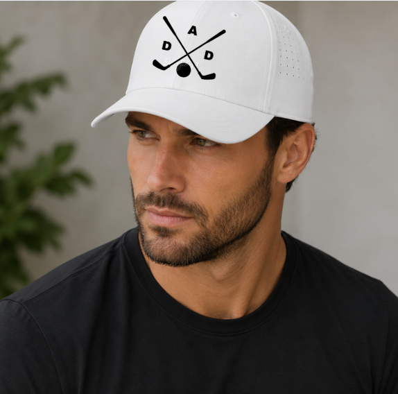 Man wearing a white cap with a logo, looking to the side.