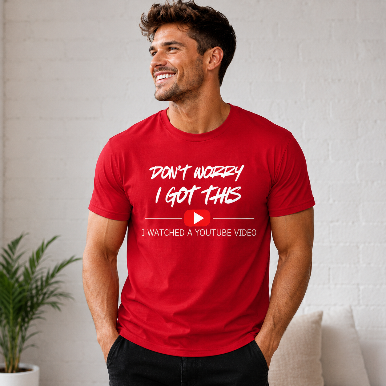 Man wearing a red t-shirt with a humorous message in a casual setting