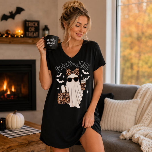 Black BOO-JEE Ghost Halloween Sleep Shirt with leopard print ghost graphic modeled in a cozy Halloween setting