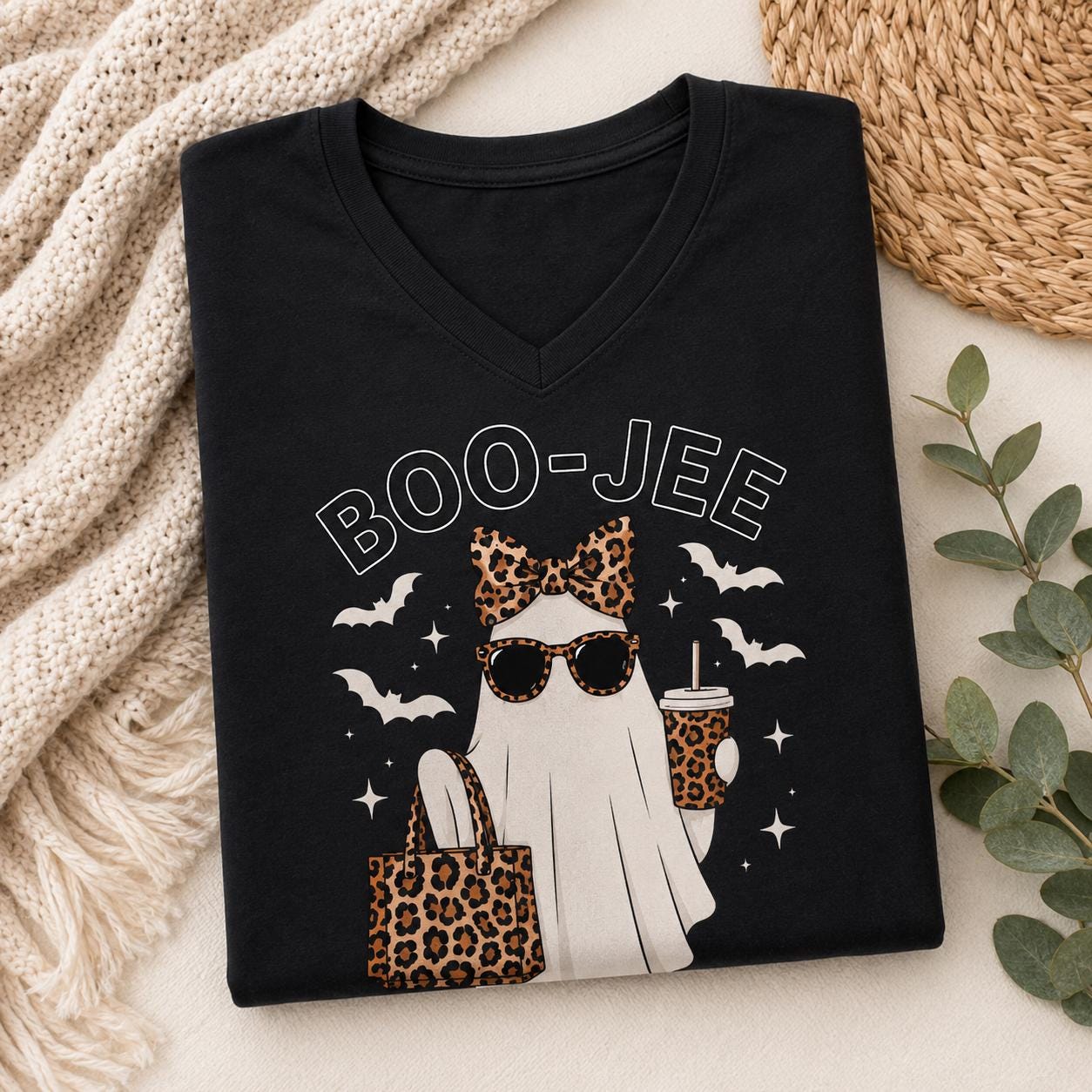 Folded black BOO-JEE Ghost Halloween Sleep Shirt with leopard print ghost graphic and V-neck design