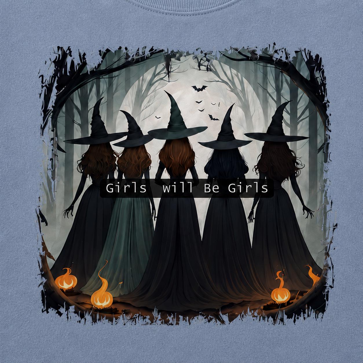 Close-up of Girls Will Be Girls Witch Sweatshirt graphic with five witches, moon, bats and glowing pumpkins
