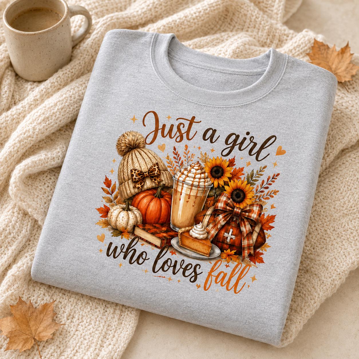 Folded gray Just a Girl Who Loves Fall Sweatshirt with pumpkin, coffee, sunflower and cozy autumn graphic
