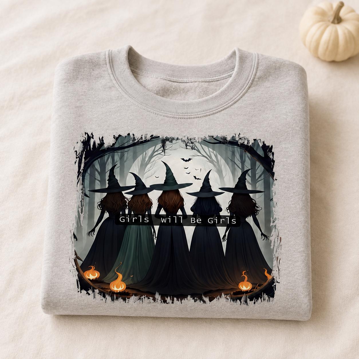 Folded gray Girls Will Be Girls Witch Sweatshirt with vintage Halloween witch graphic and pumpkin accent
