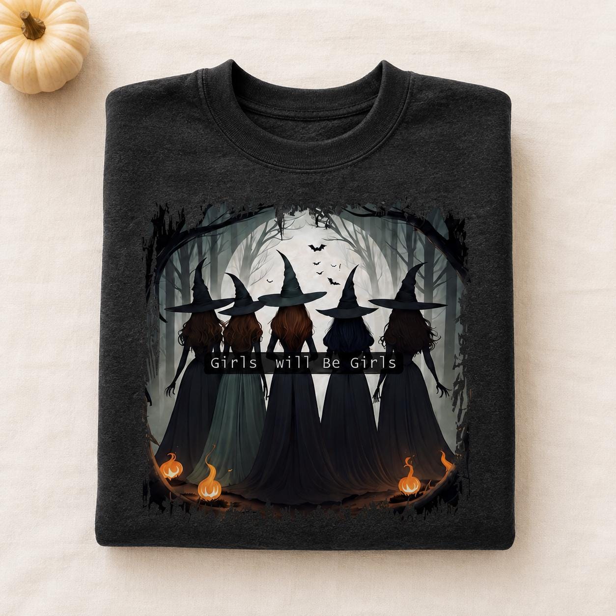 Folded charcoal Girls Will Be Girls Witch Sweatshirt with vintage Halloween witch graphic and pumpkin accents

