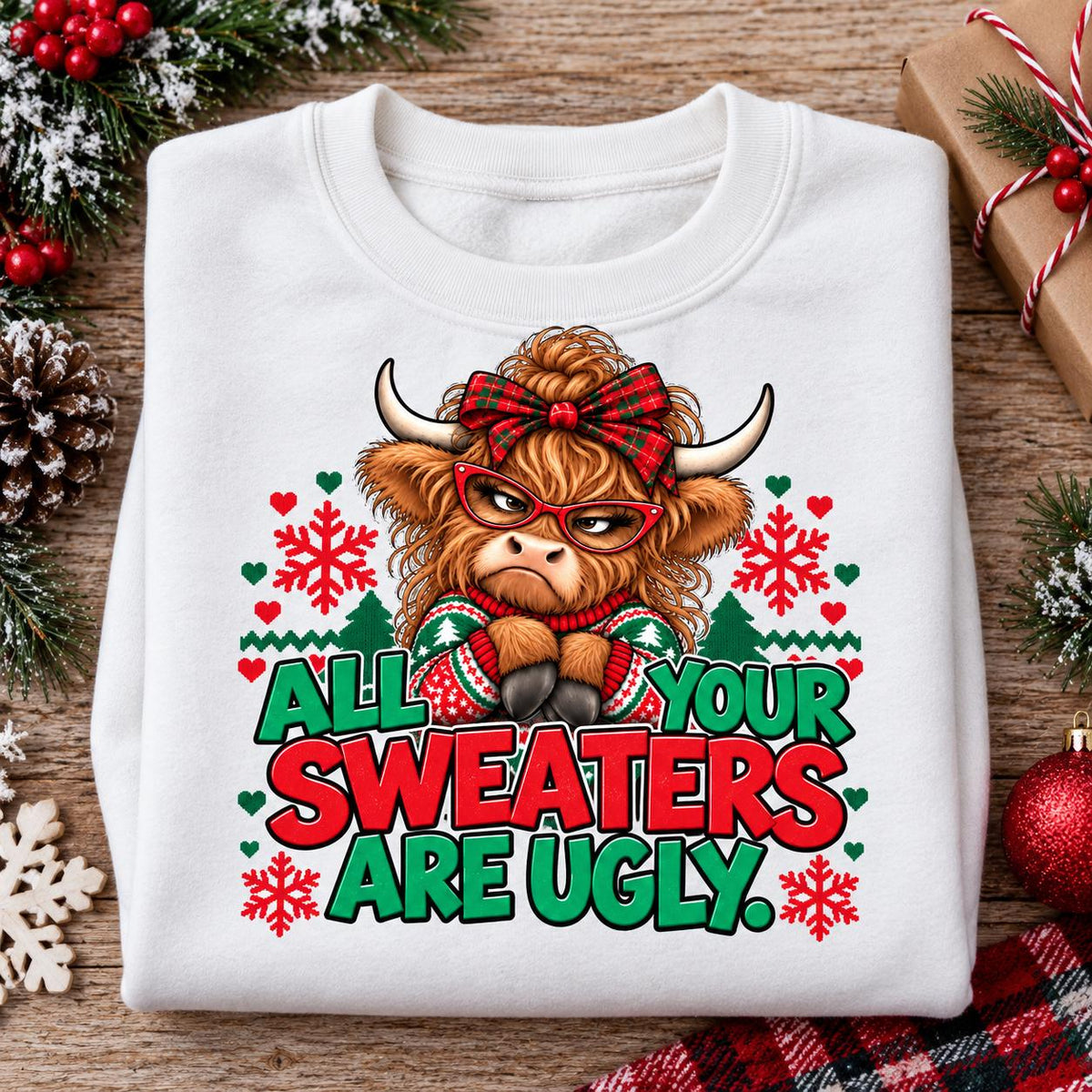 Folded White Highland cow Christmas sweatshirt with ugly sweater party design.