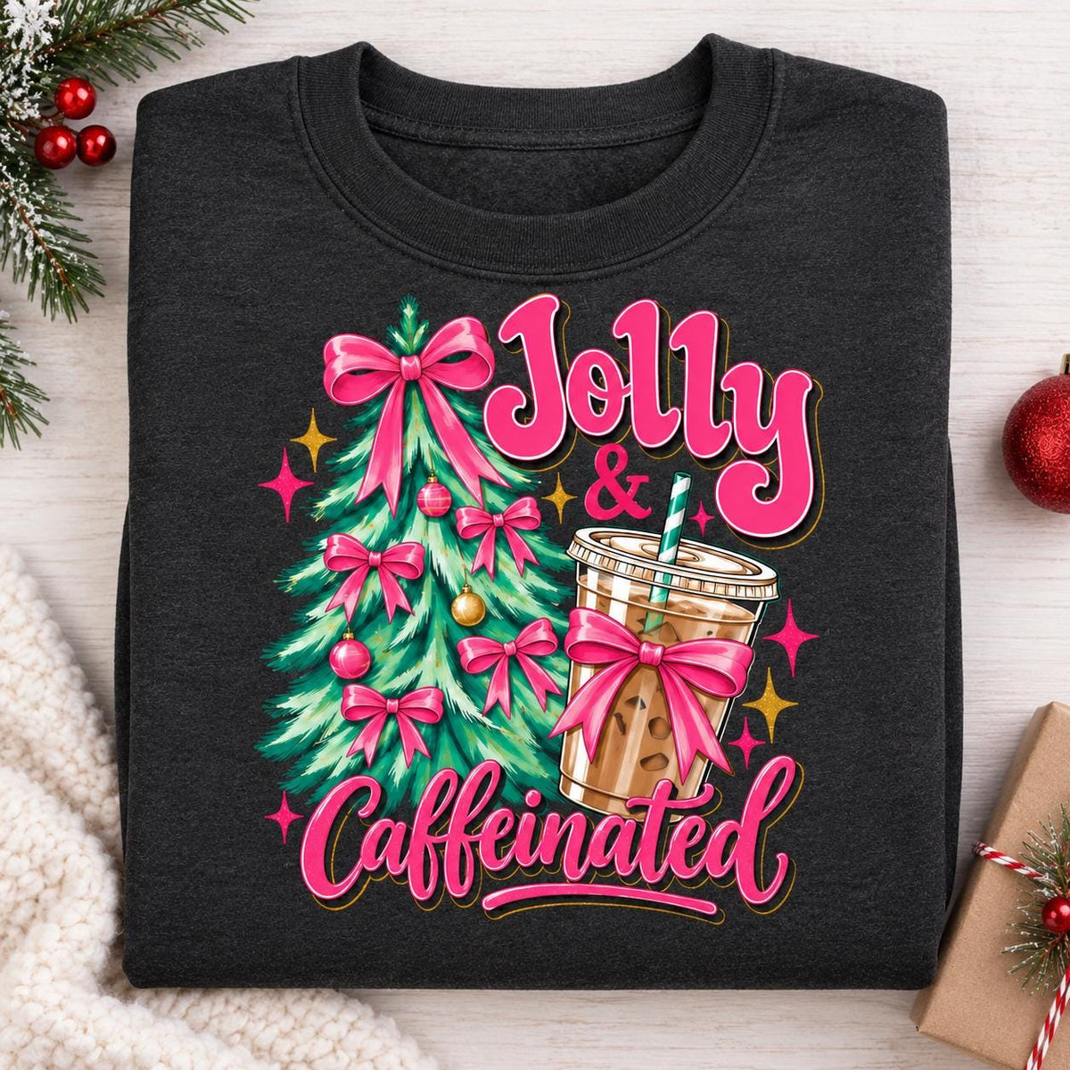Folded Heather Black Christmas coffee sweatshirt with pink bows and iced coffee.