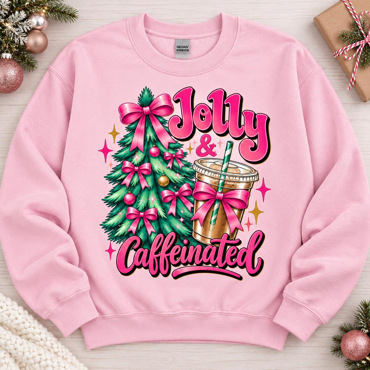 Light Pink Jolly and Caffeinated holiday sweatshirt laid flat.