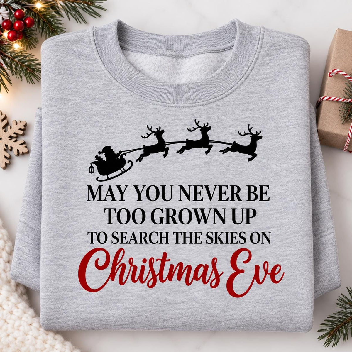 Folded Sport Gray Santa sleigh sweatshirt with Christmas Eve message.