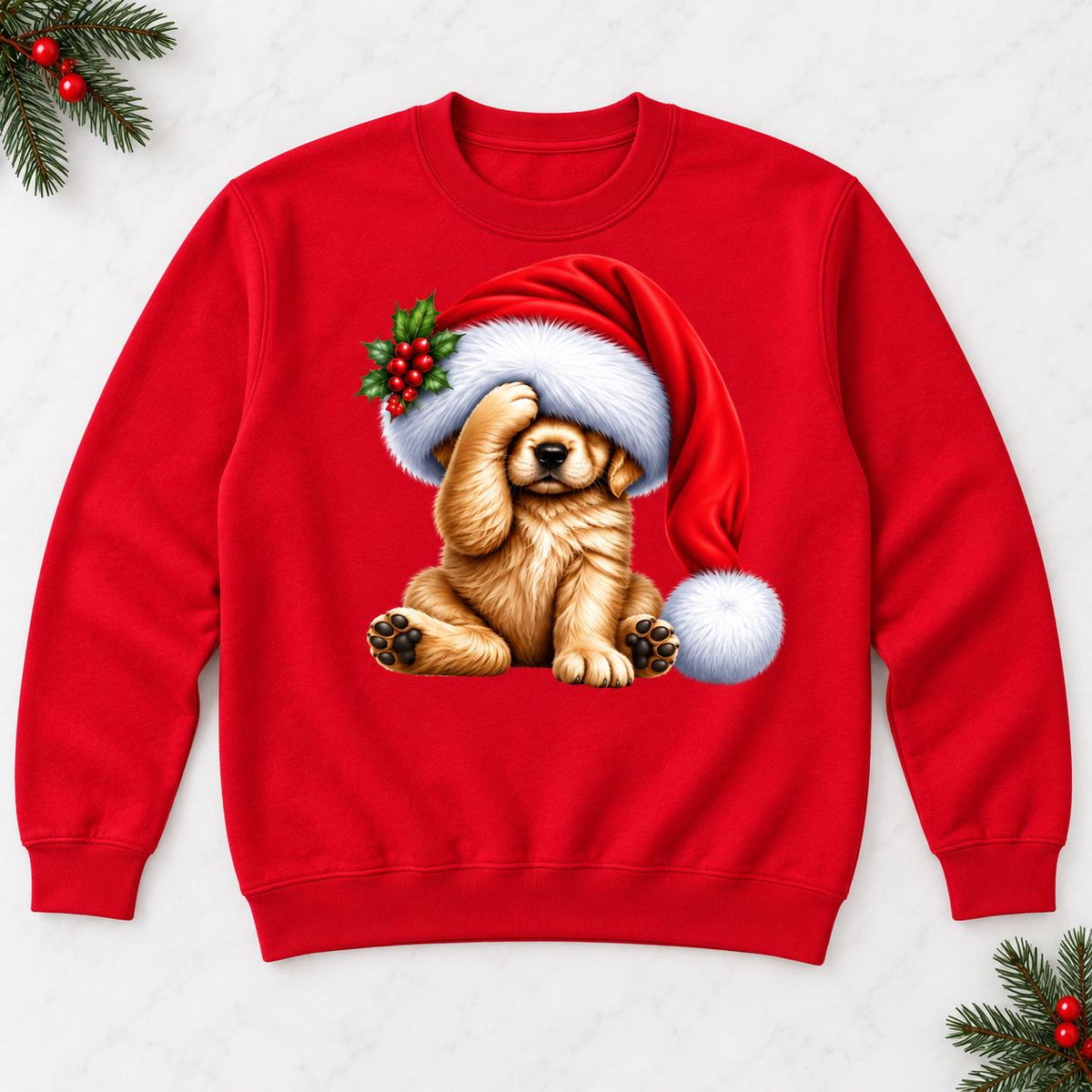 Red Christmas puppy sweatshirt laid flat, featuring a golden dog beneath an oversized red Santa hat.