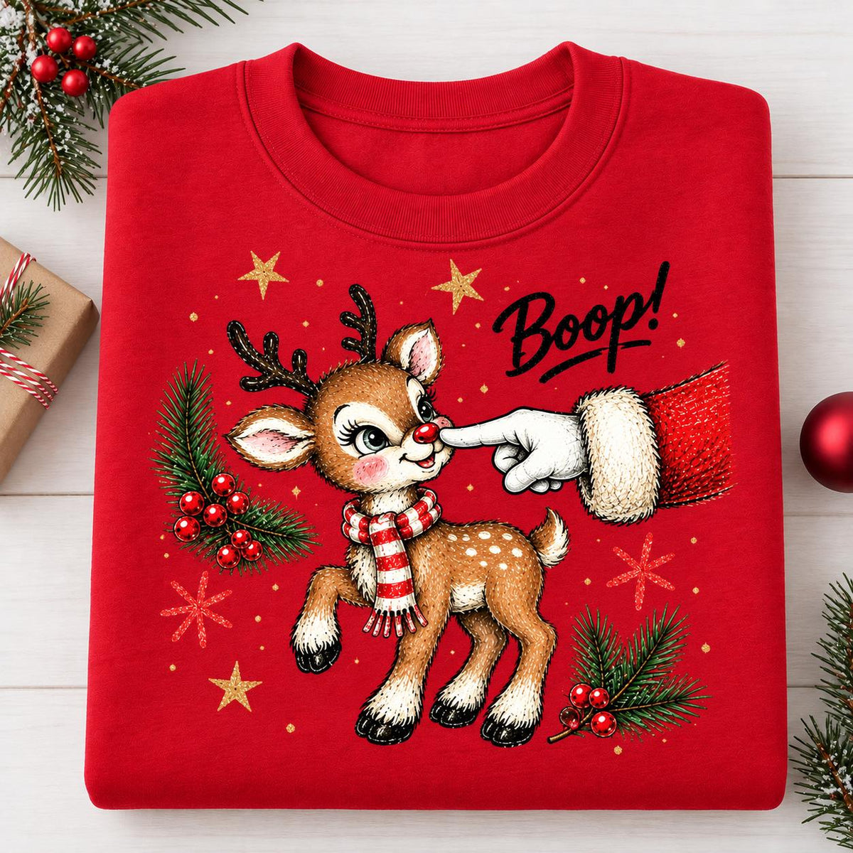 Folded Red Christmas sweatshirt featuring Santa booping a reindeer.