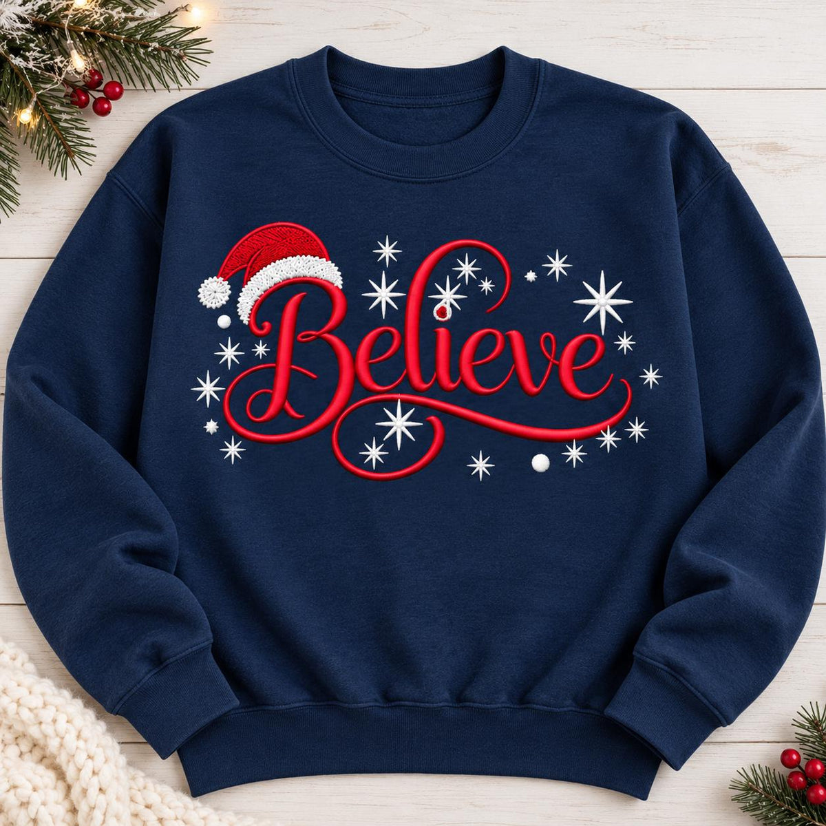 Navy Believe Christmas sweatshirt laid flat with festive Santa hat design.