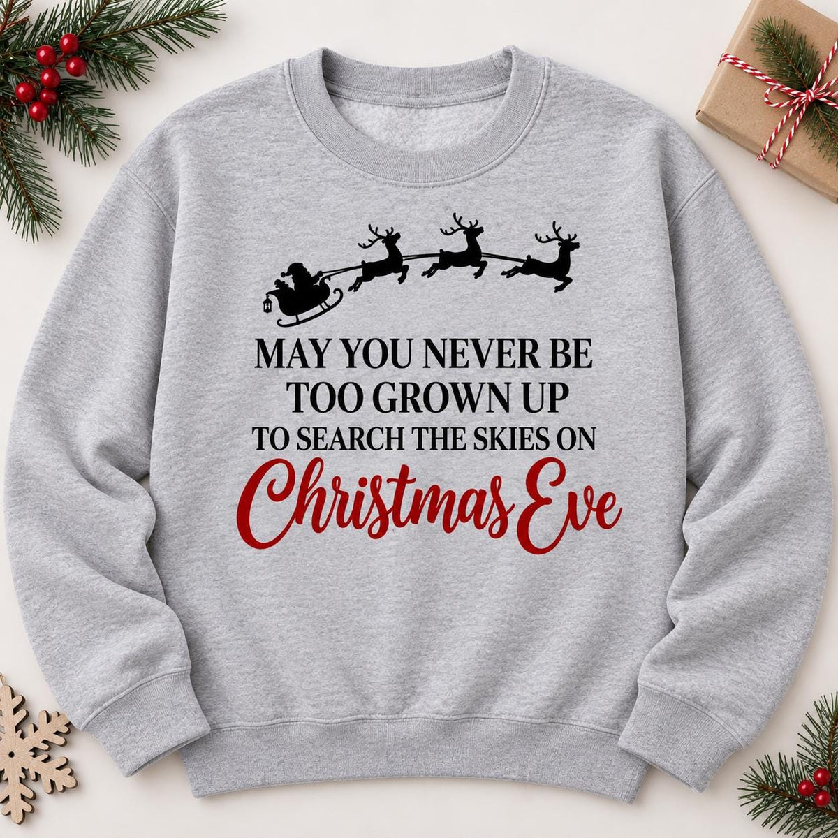 Sport Gray Christmas Eve sweatshirt laid flat with Santa flying across the sky.