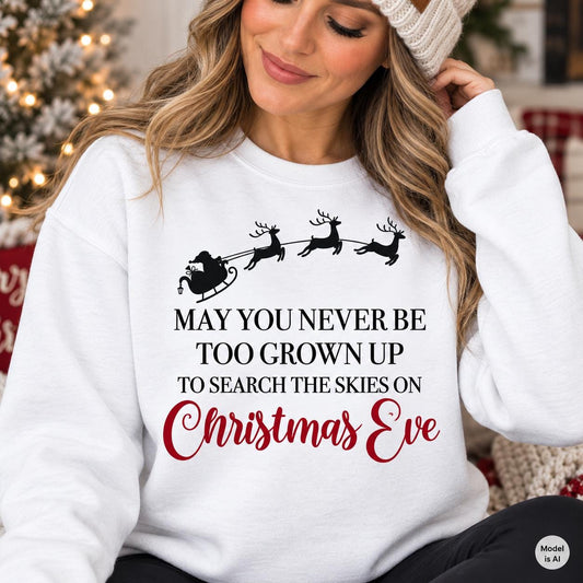 Woman wearing a white Christmas Eve sweatshirt with Santa sleigh and reindeer design.