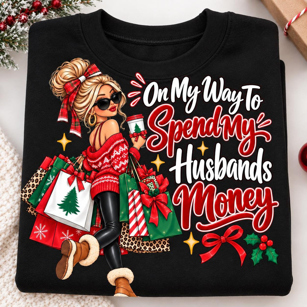 Close-up of the funny Christmas shopper design on a black crewneck sweatshirt.