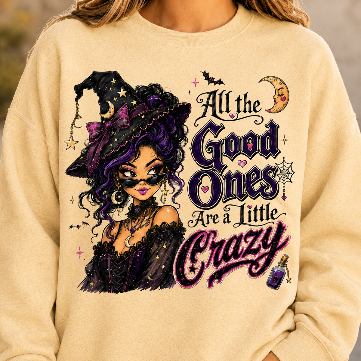 Yellow Haze Halloween witch sweatshirt featuring the “All the Good Ones Are a Little Crazy” graphic with a purple and black witch, moon, bats, and potion details.
