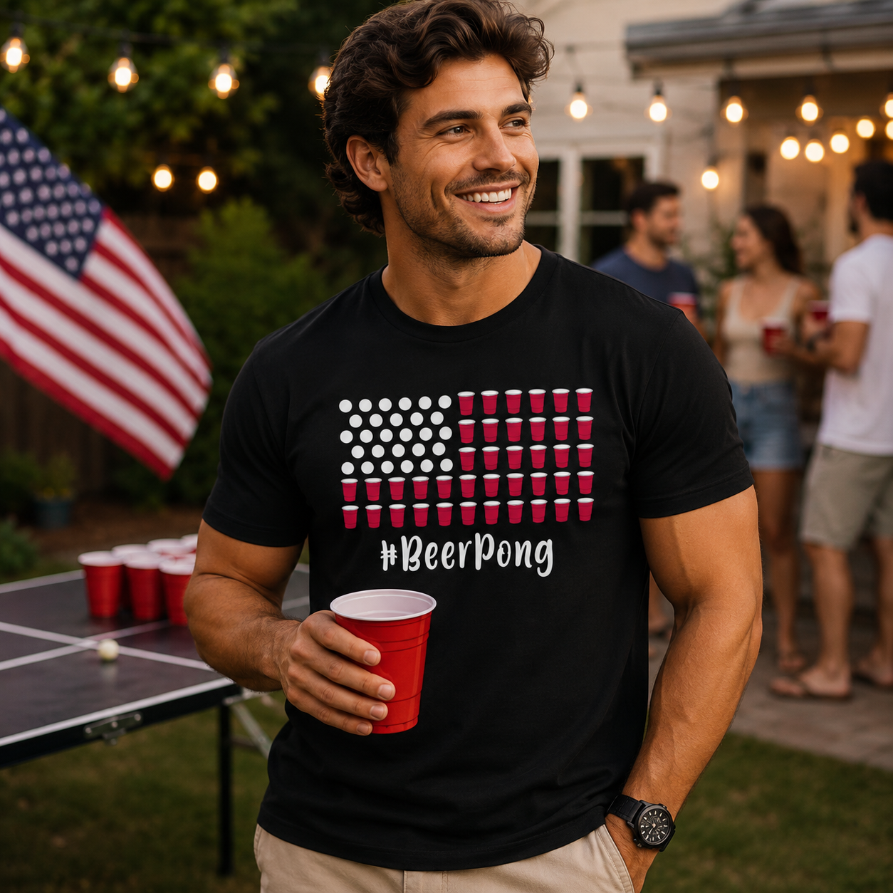 Man wearing a black t-shirt with a '#BeerPong' design, holding a red cup outdoors.