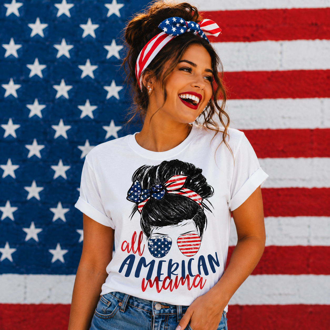 Woman wearing a white t-shirt with 'All American Mama' design in front of an American flag.